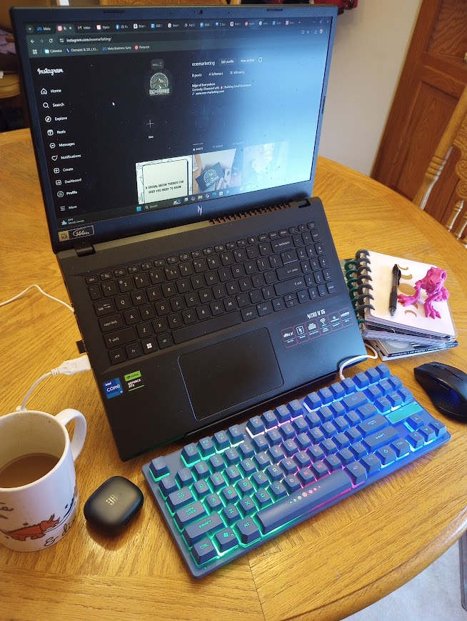 Kelby's creative desk with coffee, laptop, and open tabs